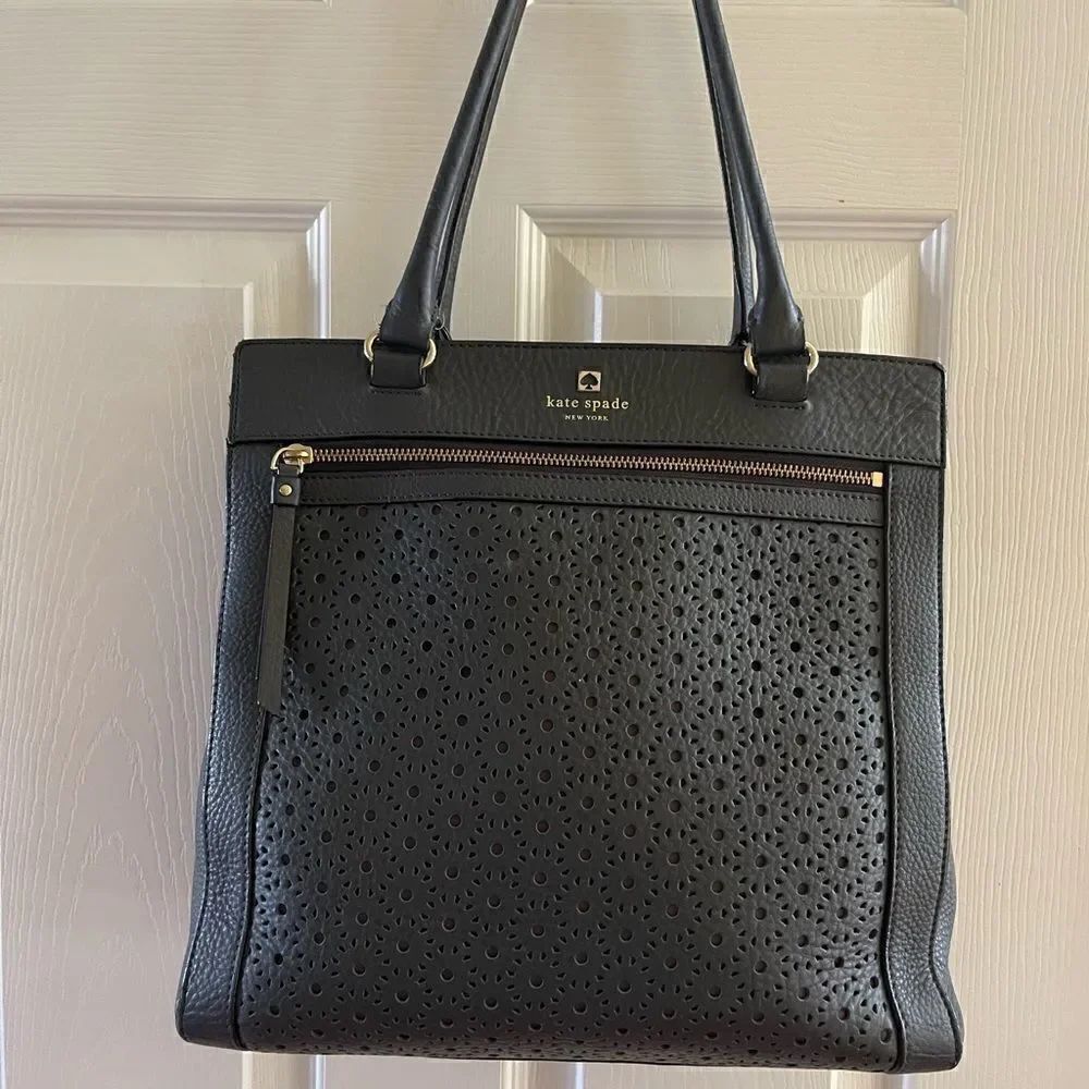 Kate Spade leather gray medium tote laser cut design gold tone hardwares.